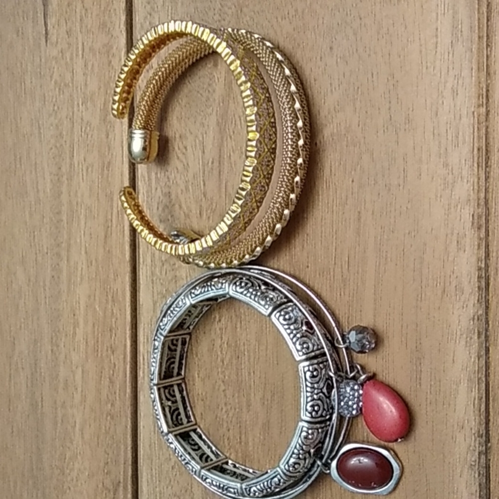 4 silver colored bracelets and 2 gold colored bracelets